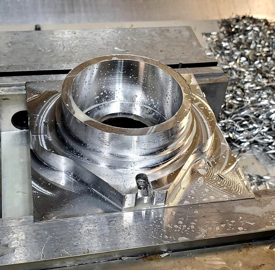 Large CNC milled aluminum housing being machined