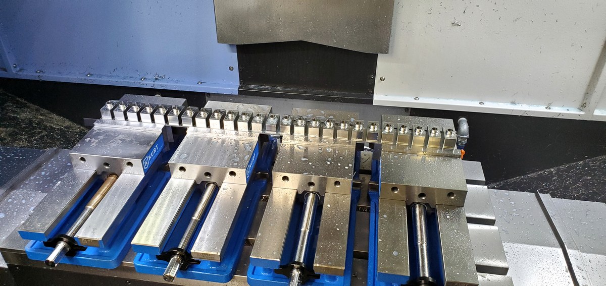 Parts fixtured in Kurt vises on CNC mill