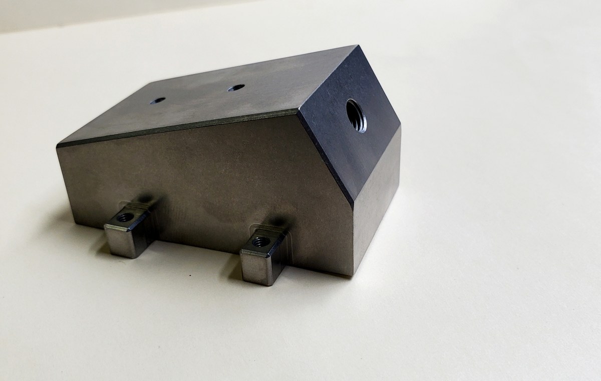 Precision steel block with threaded bosses